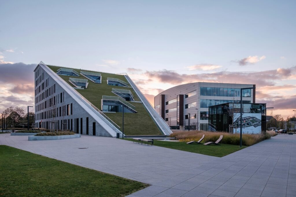 Innovative architecture at Corda Campus in Hasselt during twilight, showcasing modern design.
