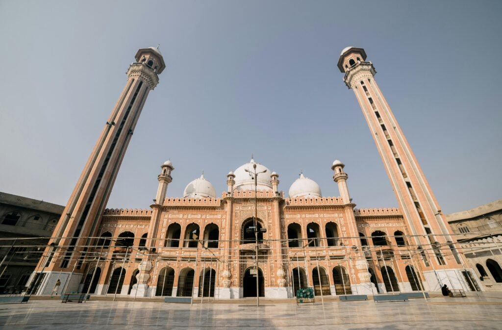 Low-angle view of the grand Jamia Masjid Al Sadiq in Faisalabad, Pakistan.